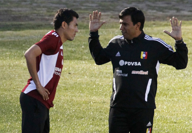 Venezuela's head coach Cesar Farias gestures as he talks with Juan Arango during a training session in La Paz