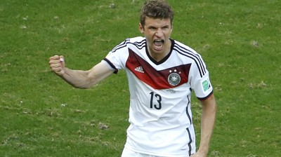 Germany's Thomas Mueller celebrates after scoring a penalty against Portugal during their 2014 World Cup Group G soccer match at the Fonte Nova arena in Salvador