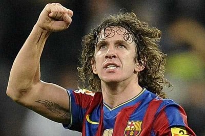 Barcelona's captain Puyol celebrates after their Spanish first division soccer match against Real Madrid in Madrid