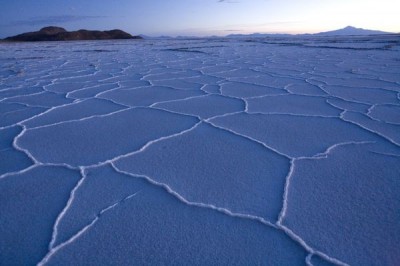 Polygonal cracks and bubble-like ridges of edible salt cover the surface of the Salar de Uyuni near Islas Asallachi